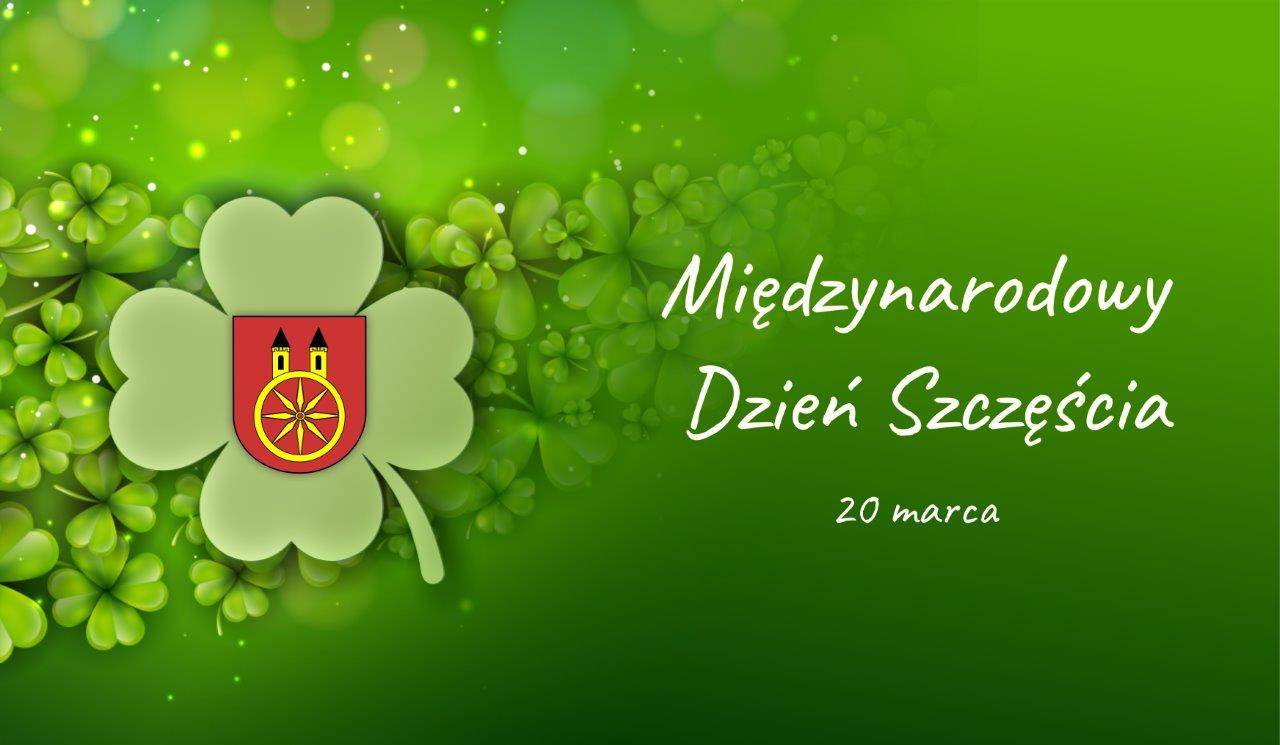 Plansza promująca Międzynarodowy Dzień Szczęścia. Na planszy widnieje napis: Międzynarodowy Dzień Szczęścia 20 marca. Z lewej strony na czterolistnej kończynie znajduje się herb miasta Koła. Plansza jest w odcieniu zielonym.