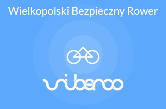 Plansza z napisem na niebieskim tle Wielkopolski Bezpieczny Rower
