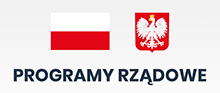 Baner z napisem programy rządowe wraz z flagą i godłem narodowym